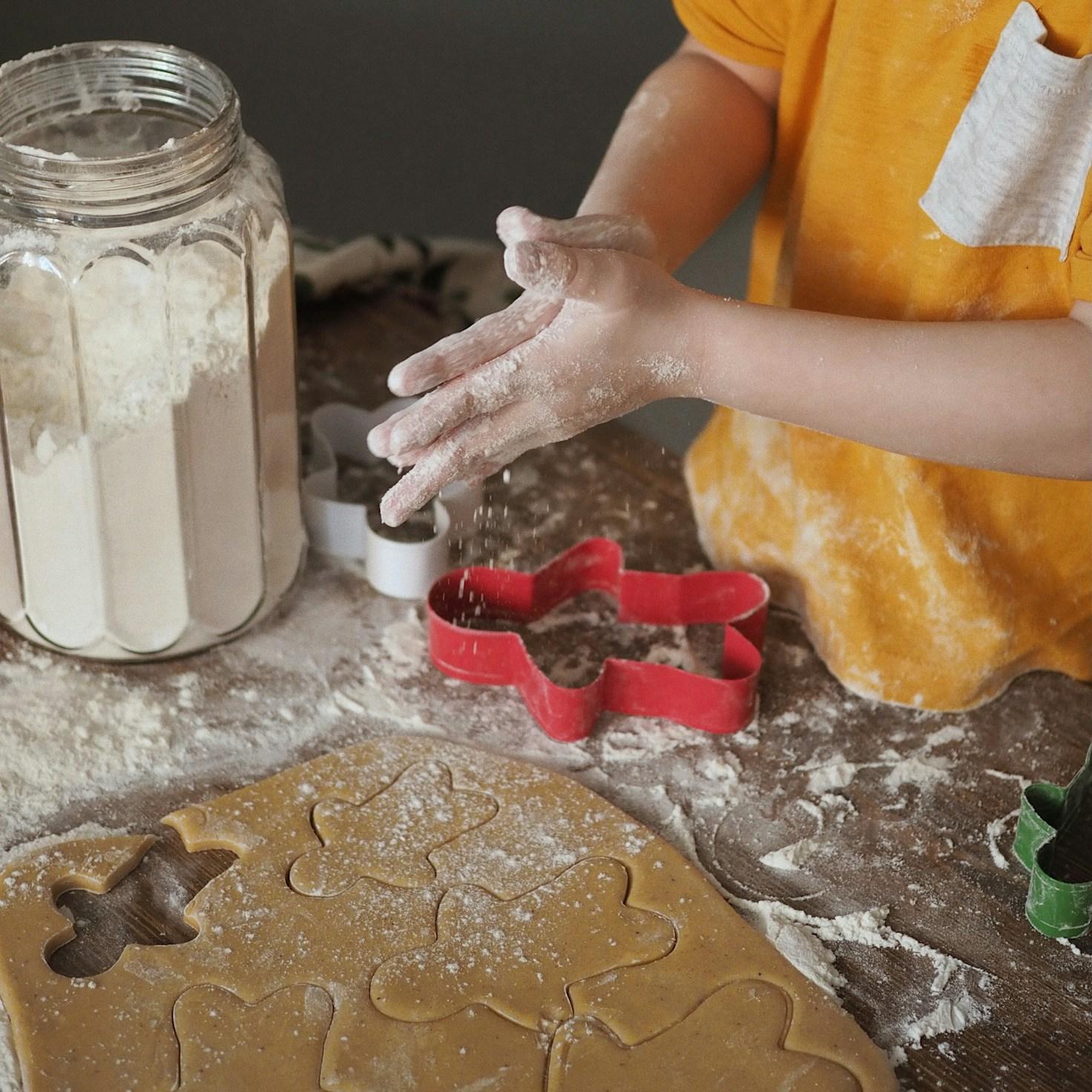 Community members collaborating in a modern kitchen space, sharing recipes and cooking techniques
